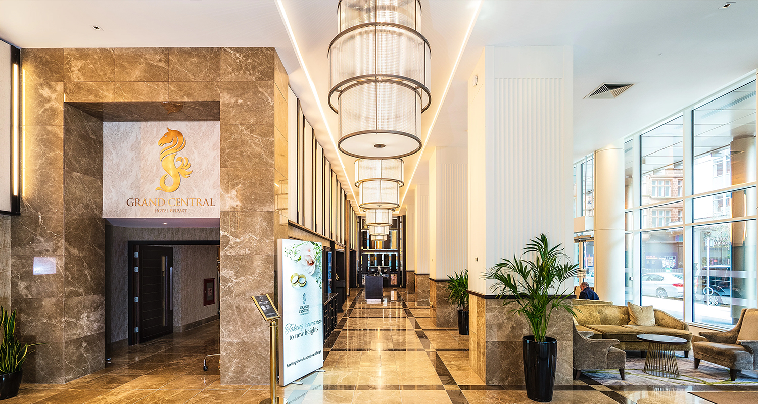 Lobby view of the a row of giant crystal pendant lampshades at the Grand Central Hotel Belfast