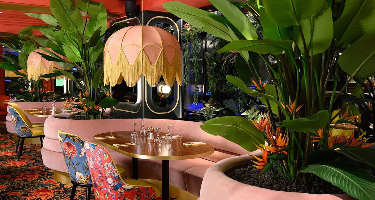 Soft pink silk dome lampshades with gold fringe at the casino restaurant 