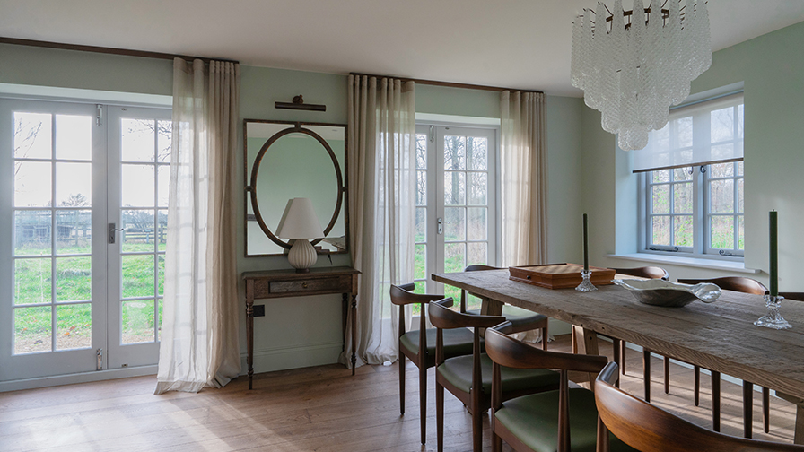 Cotswolds dining room with VENESTRE bespoke sheer curtains on French doors and V01 sheer roller blinds on windows. The elegant window treatments enhance natural light and complement period details, demonstrating VENESTRE’s commitment to luxury, made-to-measure solutions for heritage interiors.