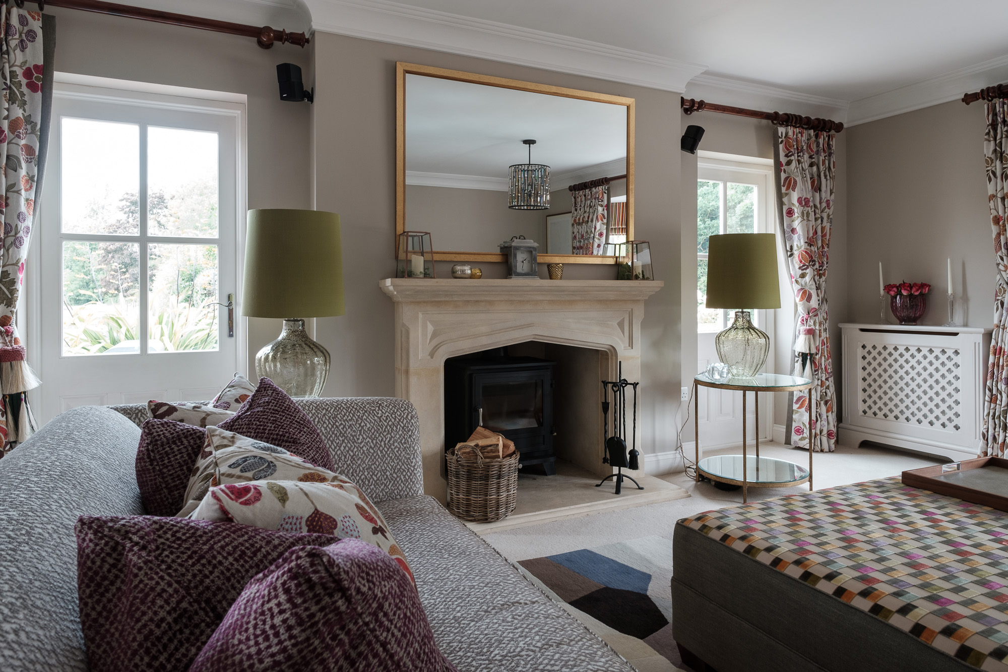 Sitting room with fire surround and lime green lamp shades