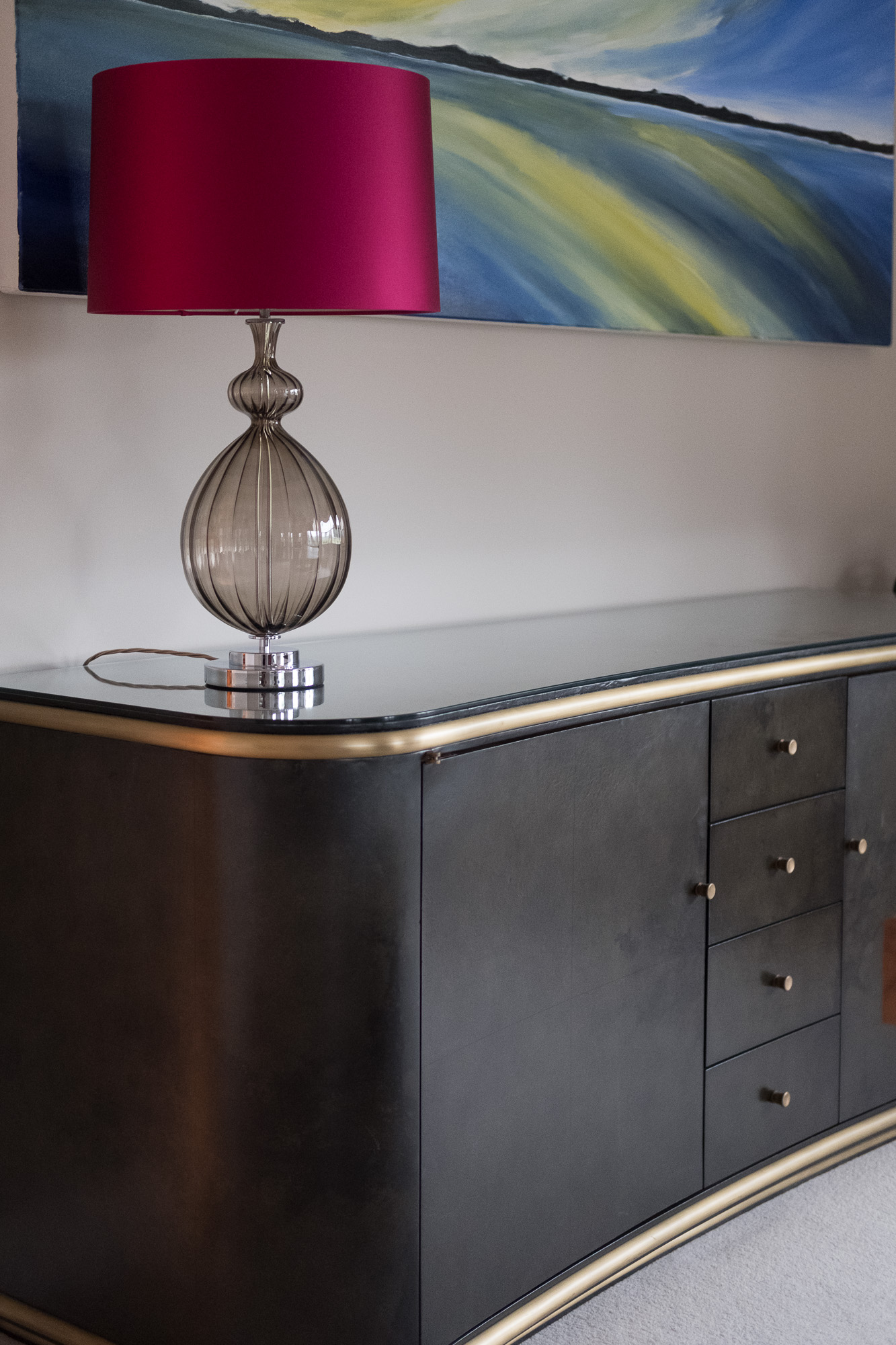 Bold Artwork and pink lamp shade