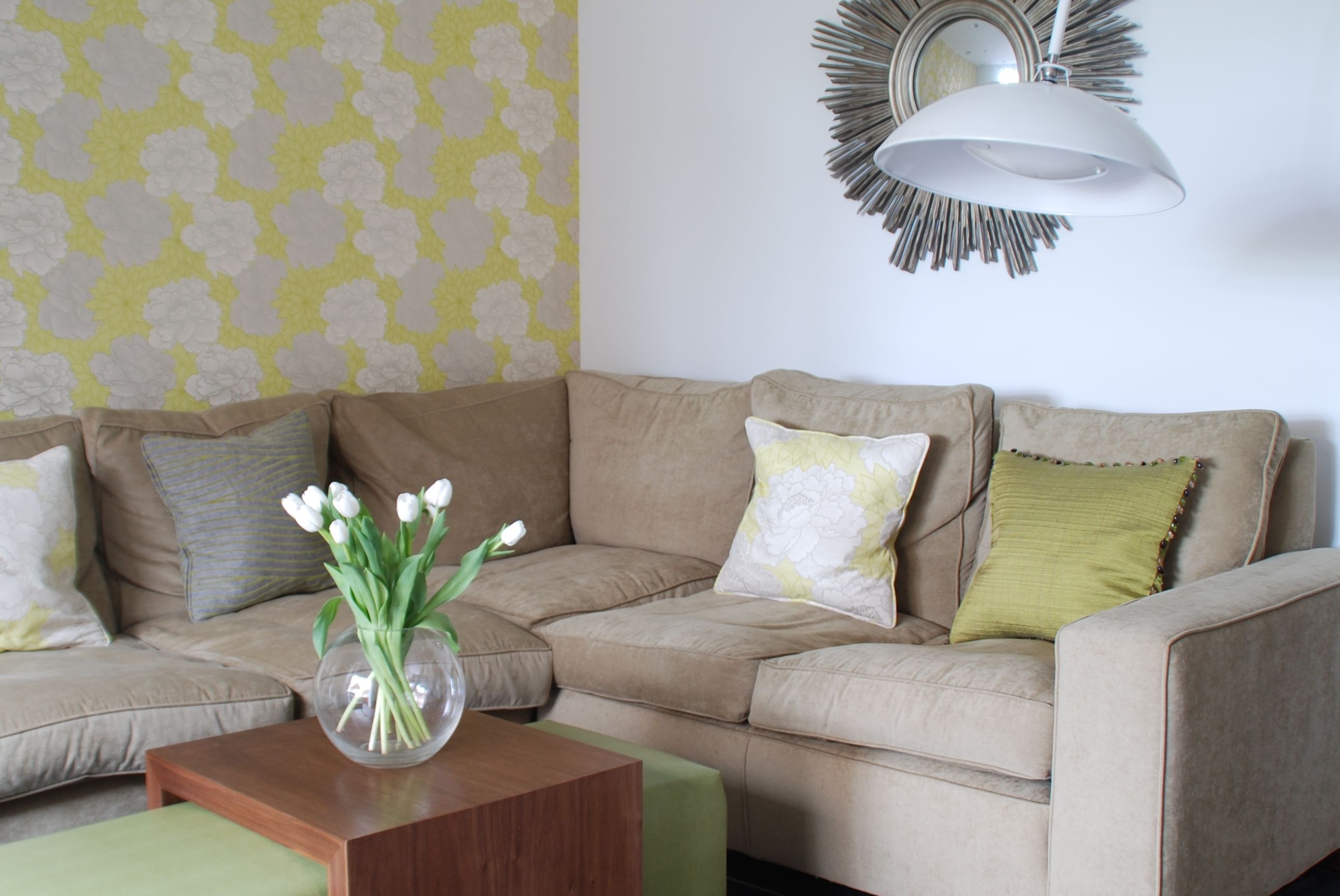 Lime green feature wall with corner sofa