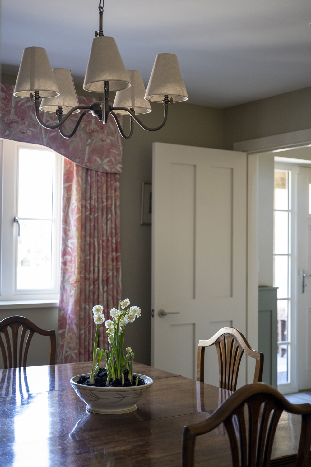 Dining room with red curtains and pelmet