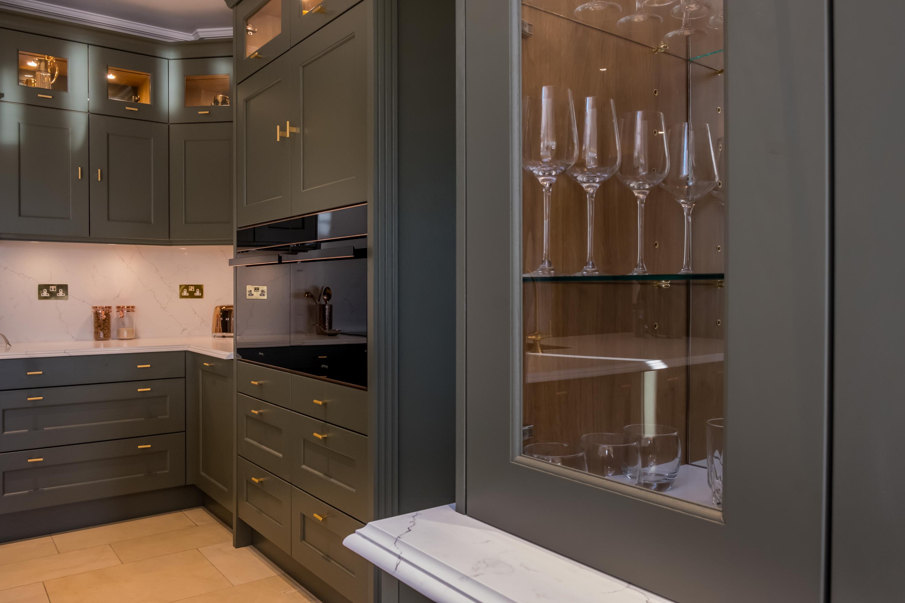 Smeg Dolce Stil Novo ovens with copper trim match the details on this bespoke kitchen.