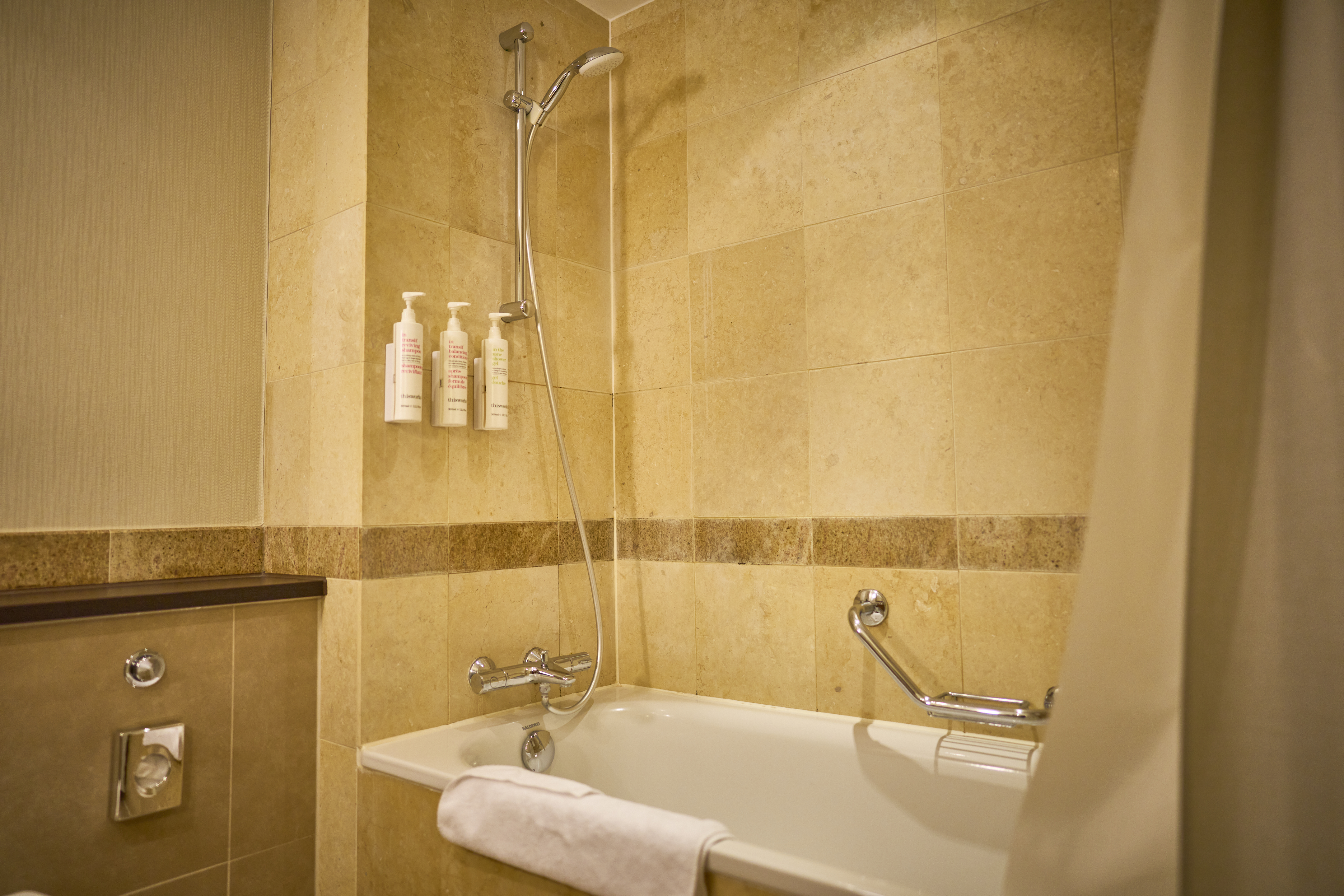 outdated bathroom, with old tiles and bath style