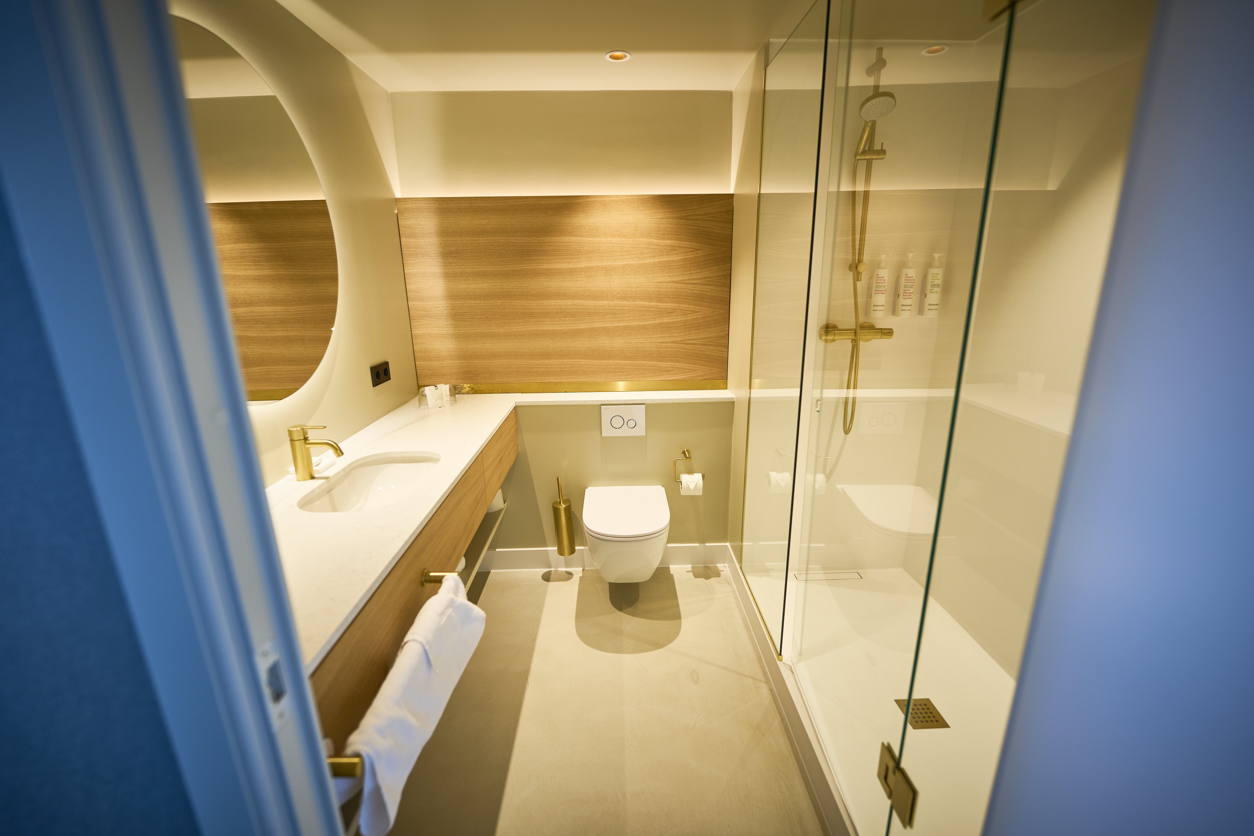 After picture shot from the bathroom entrance door showing a landscape view of the bathroom transformed