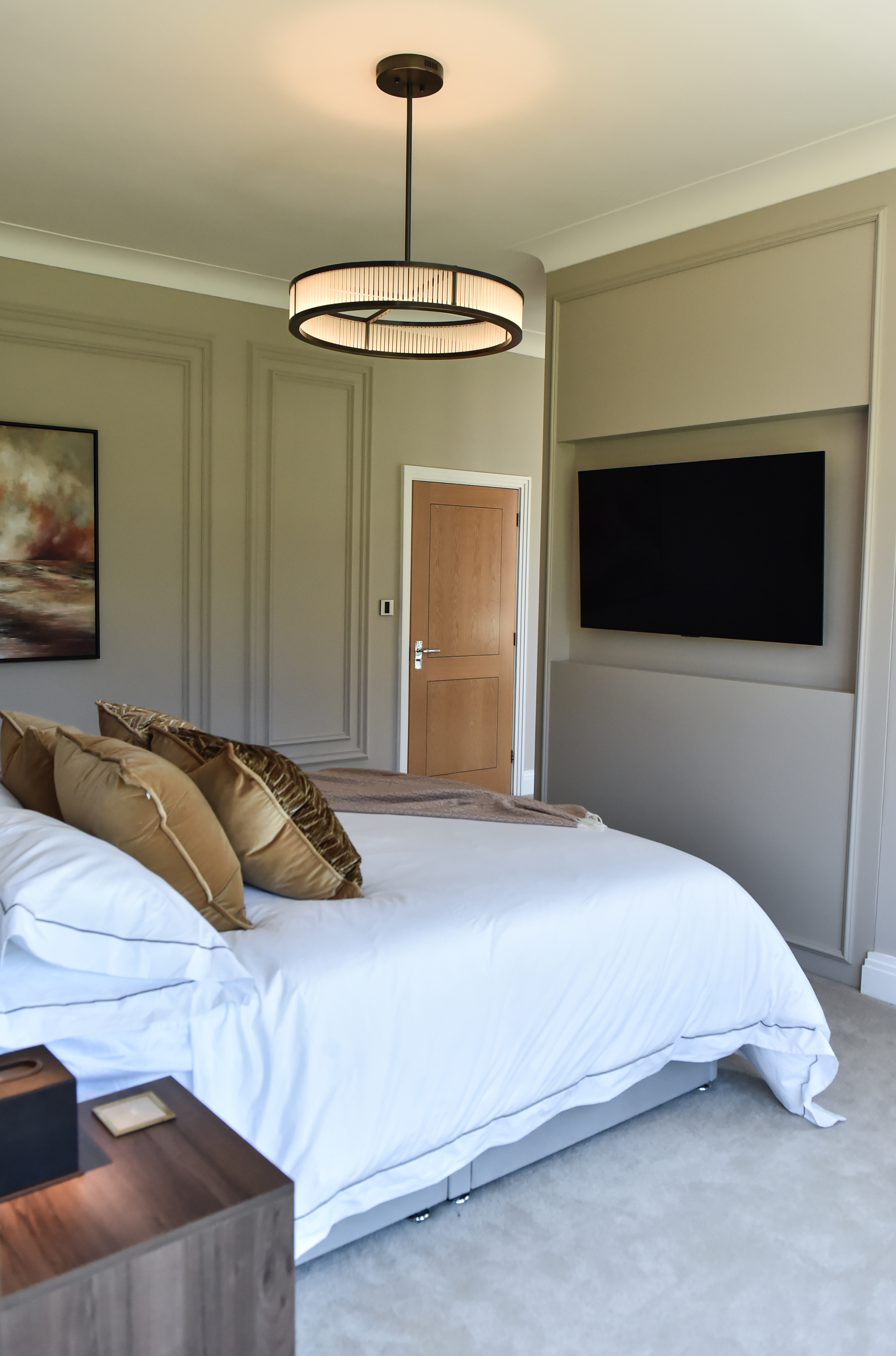 Another view of the room, with bespoke cabinetry to hold the tv and  storage 