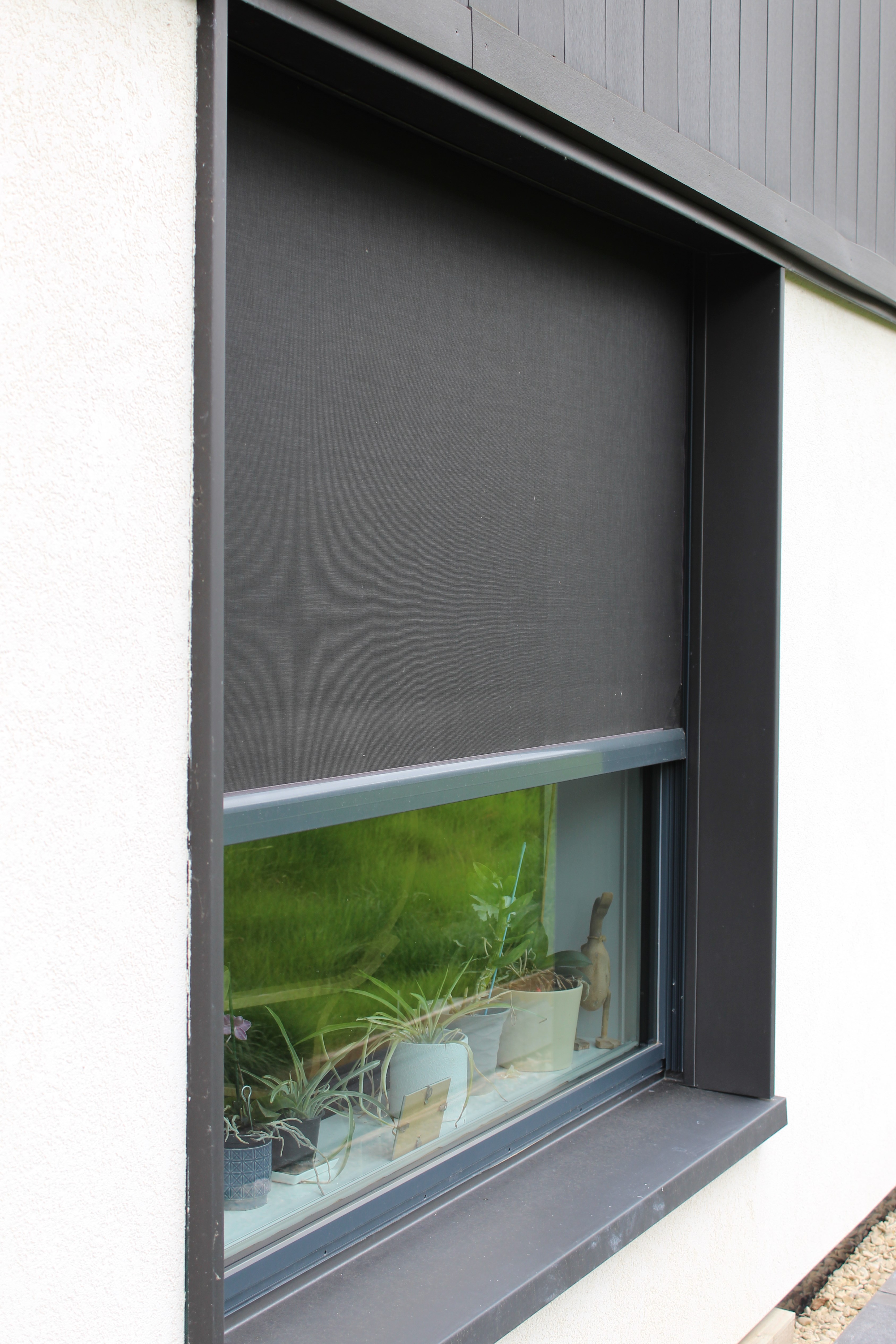 Phantom Screens’ discreet solar mesh allowing natural light and views while reducing heat and glare