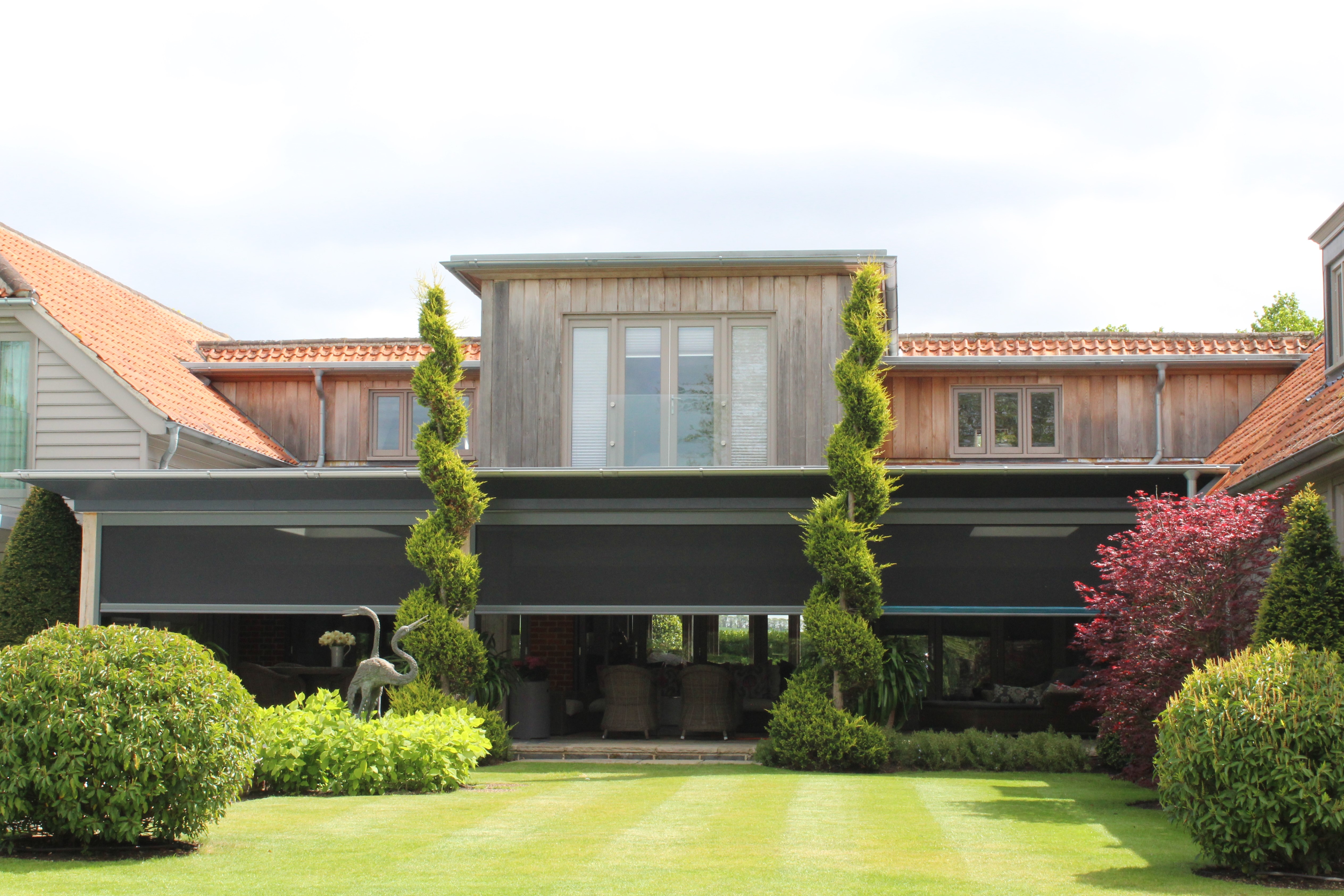 Power screens shielding seating area from the bugs