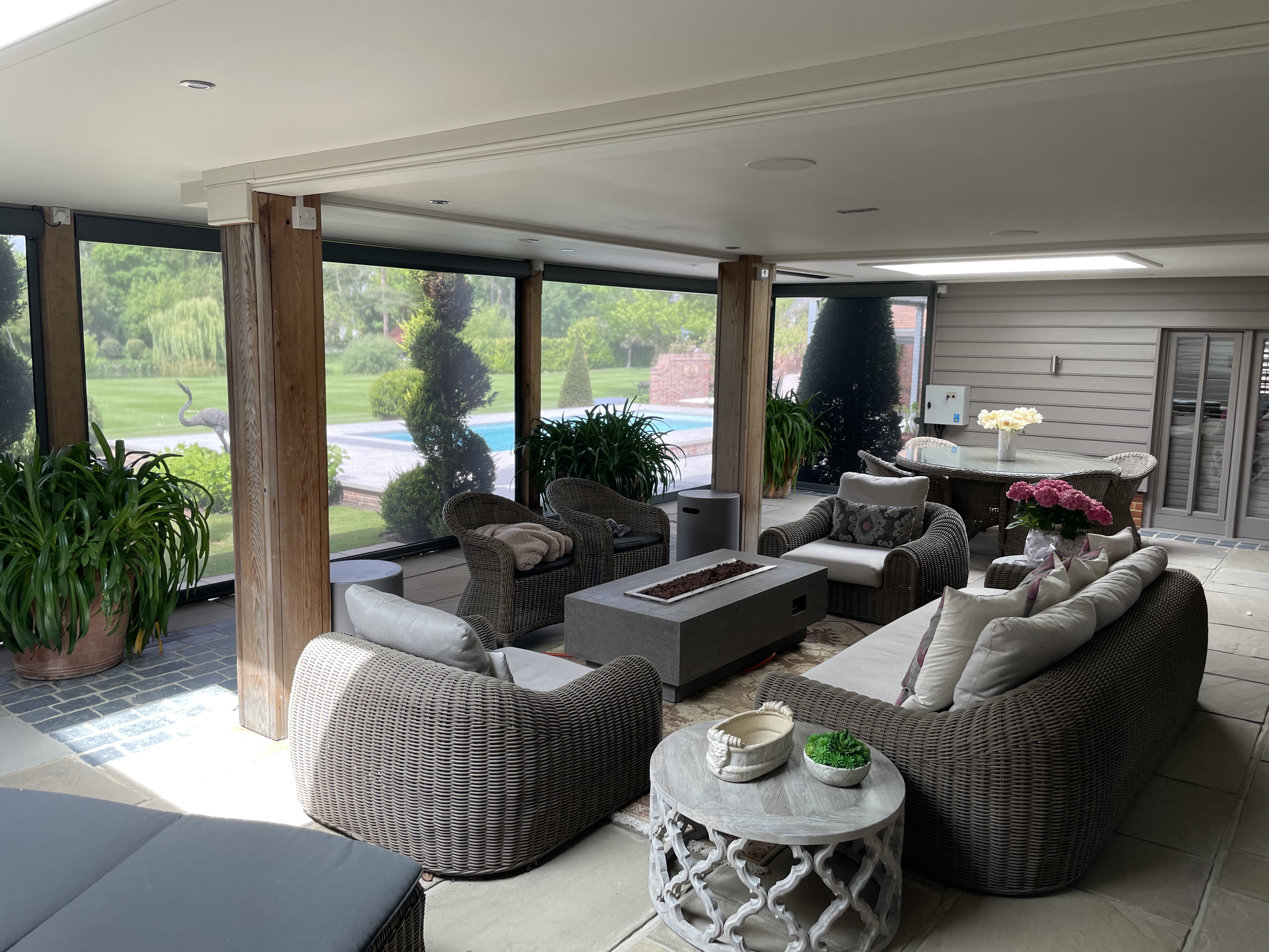 Inside a veranda covered with automated screens for insect protection