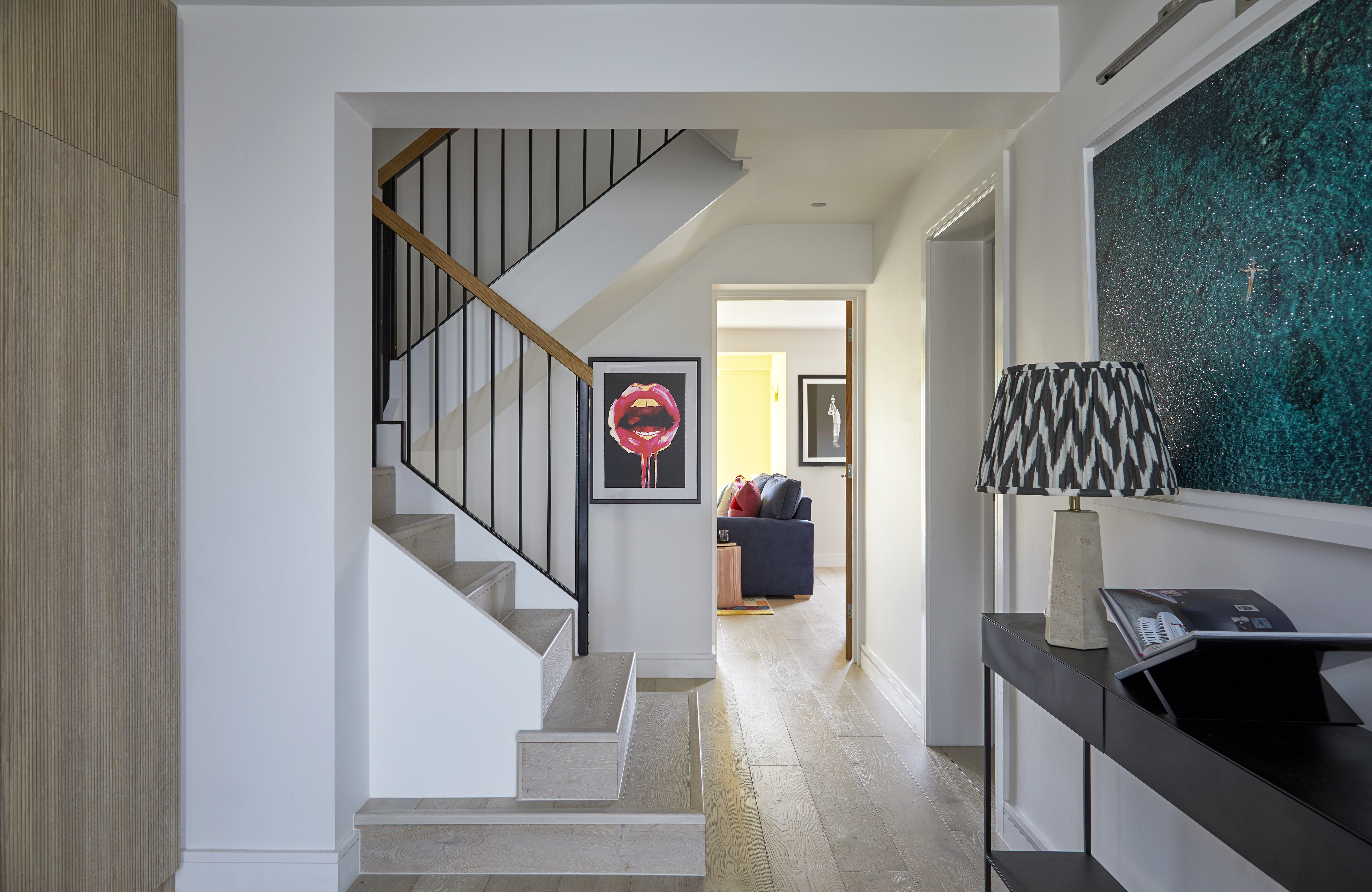 Statement artwork injecting personality into the home, complete with an elegant and modern staircase