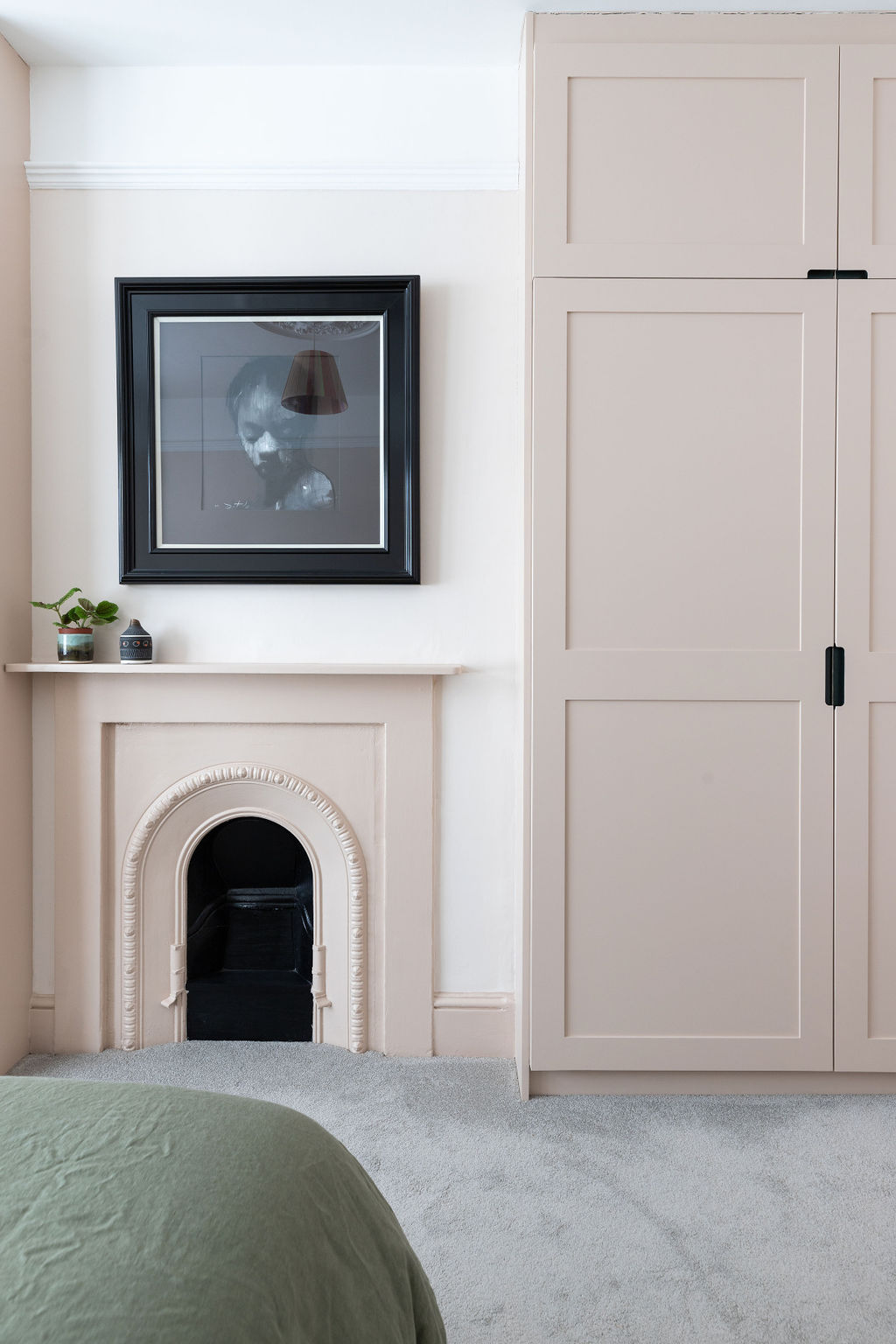 Traditional bespoke joinery, painted in the same tone as the fireplace