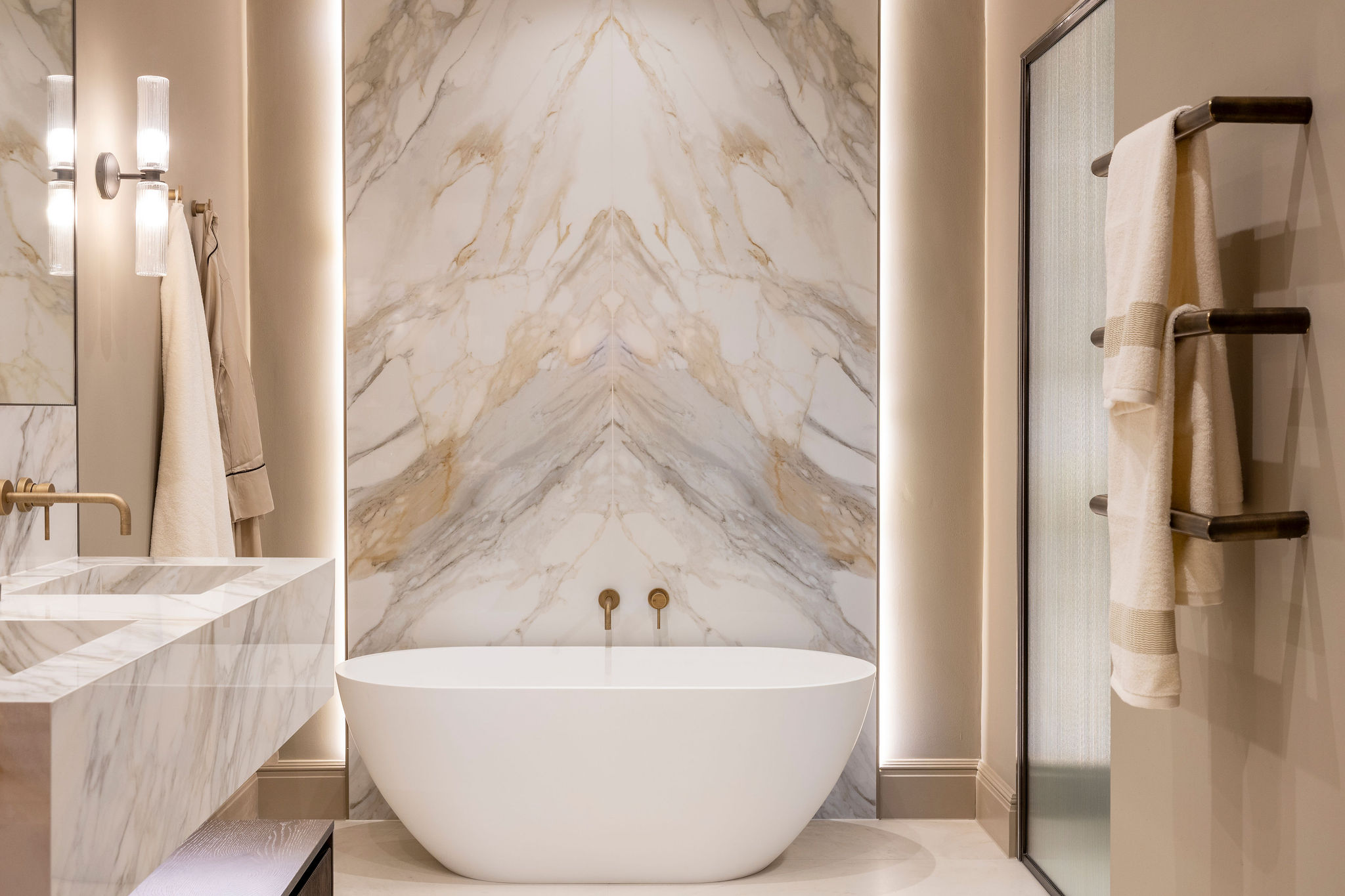 A luxury stylish bathroom in neutral tones, with stunning high end finishes.