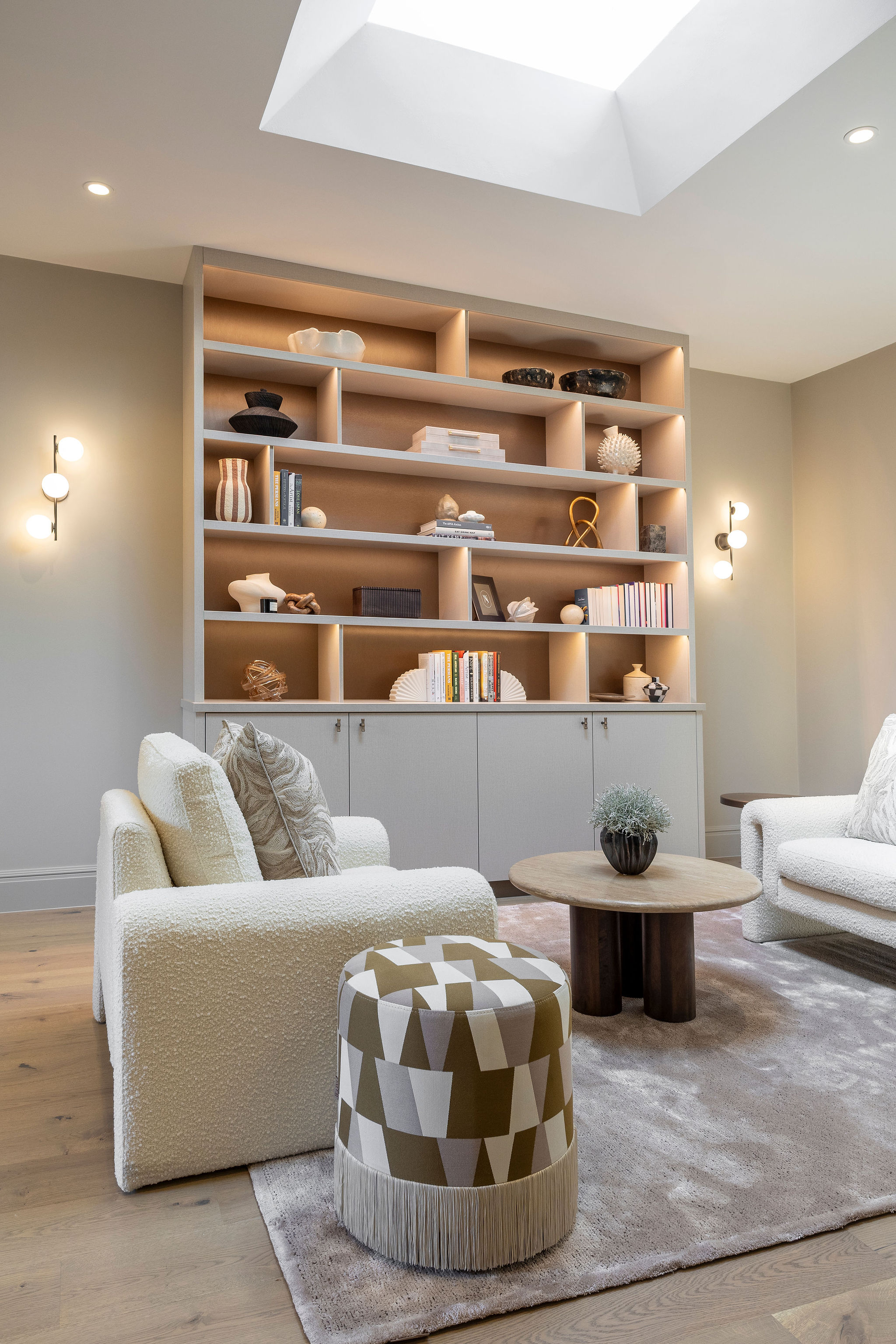 Lighting is everything - the skylight and wall lights ensure a fresh yet cosy feel is achieved in this elegant lounge.