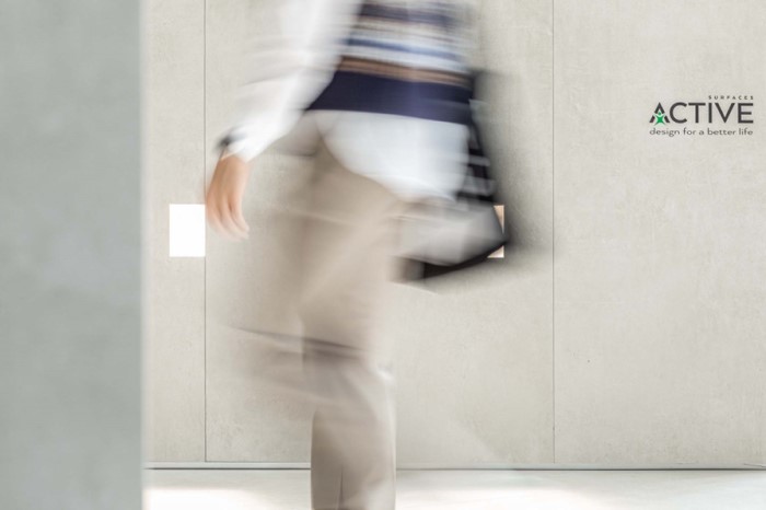 blurred person walking past Active logo