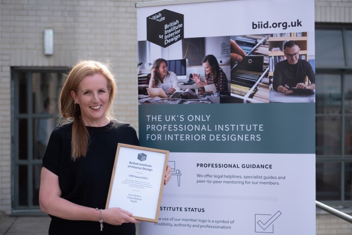 woman holding certificate.