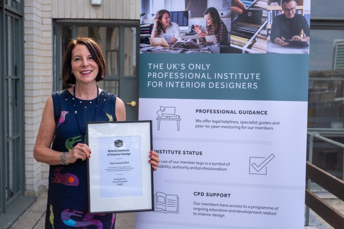 woman holding certificate.