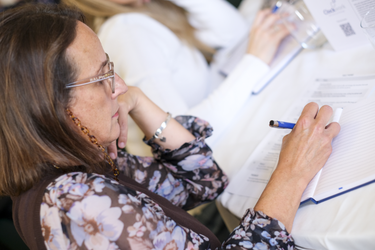 Woman writing at event
