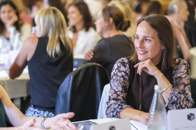 Woman smiling at conference