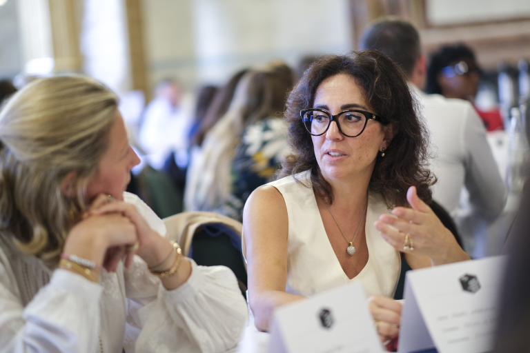 Woman speaking to colleague