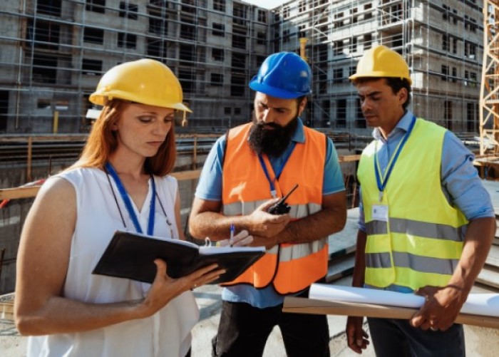 Designer and contractors on site