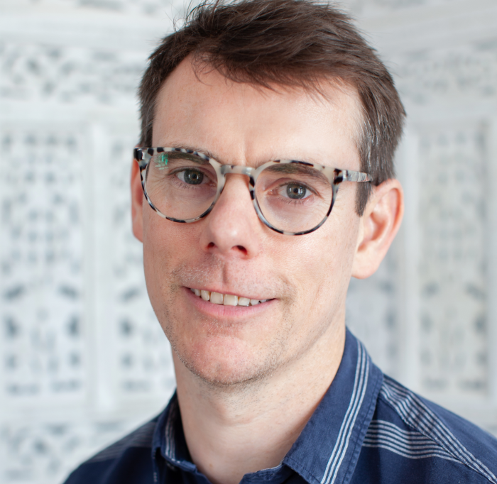 smiling man with glasses