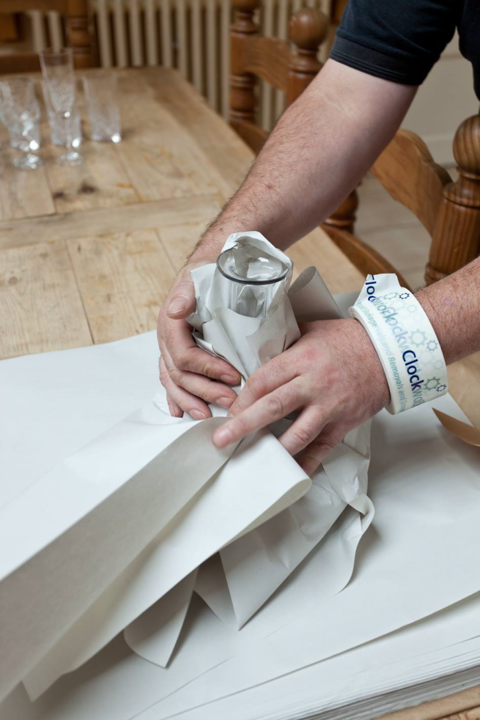 someone packing glassware.