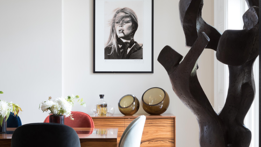 Dining area with sculpture & portraits