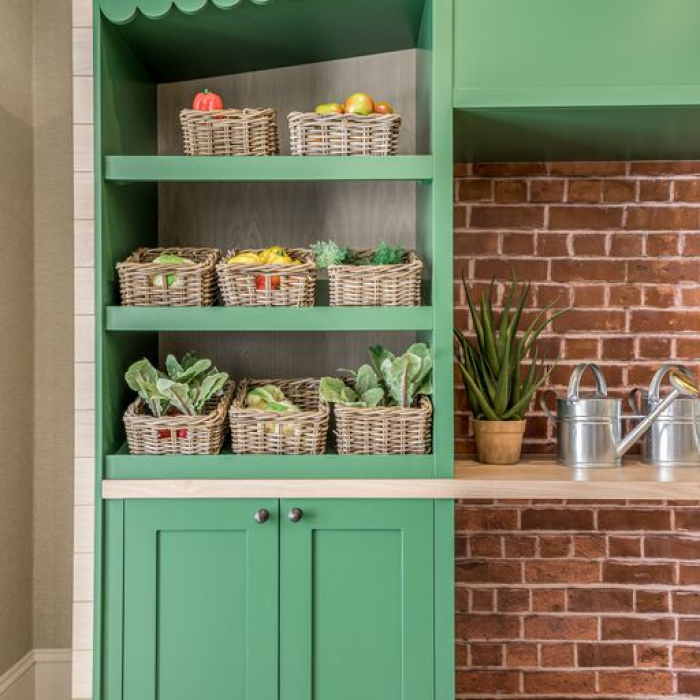 cupboard with baskets of fruit and vegetables
