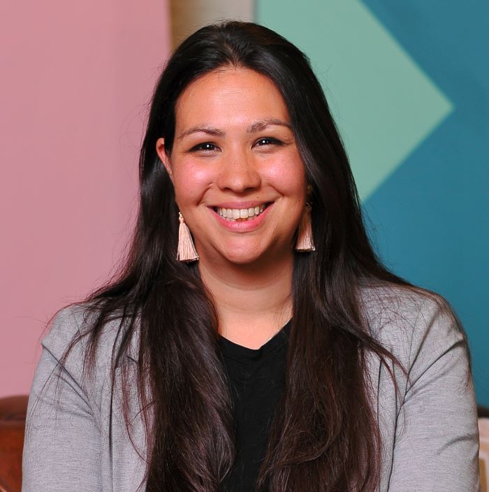 smiling dark haired woman