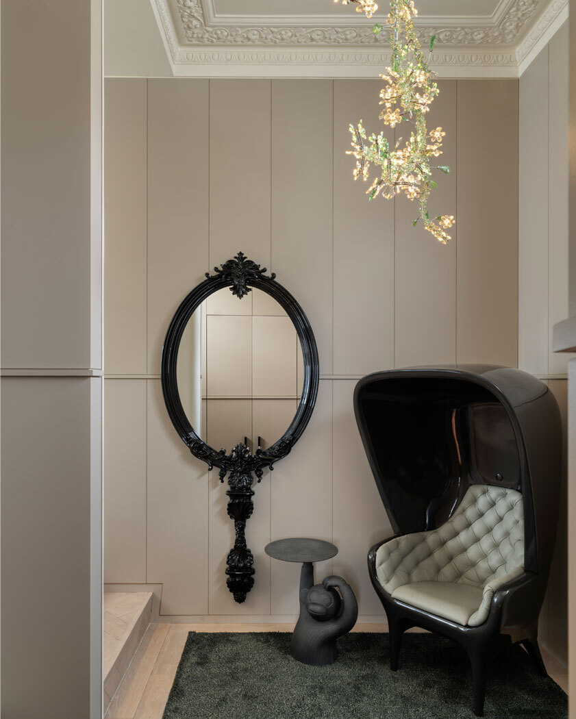 Chair and mirror in hallway