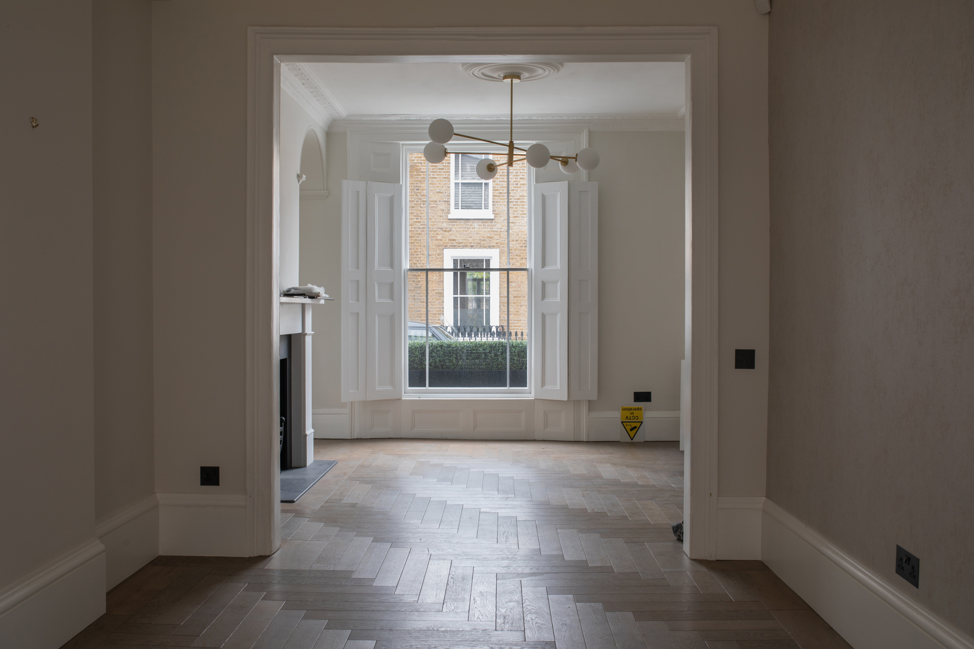 Completed interior architecture shell within a Chelsea townhouse, showing restored period proportions and layout planning as part of a high-end, full turnkey residential renovation.