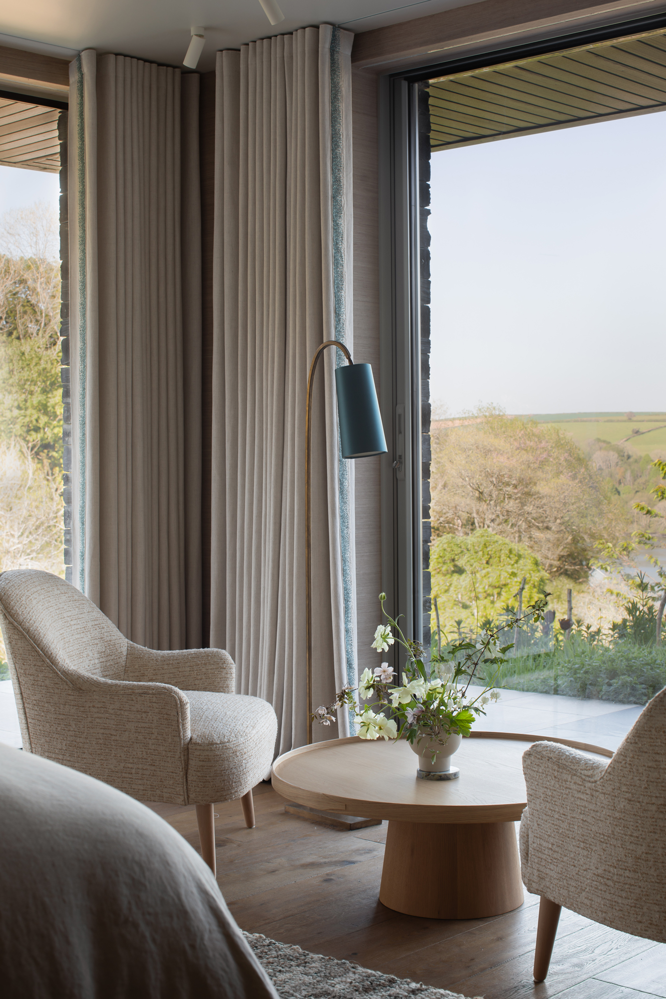 Calm private sitting area within a contemporary riverside new build, fully designed and furnished as part of a high-end, turnkey interior architecture project focused on comfort and retreat.