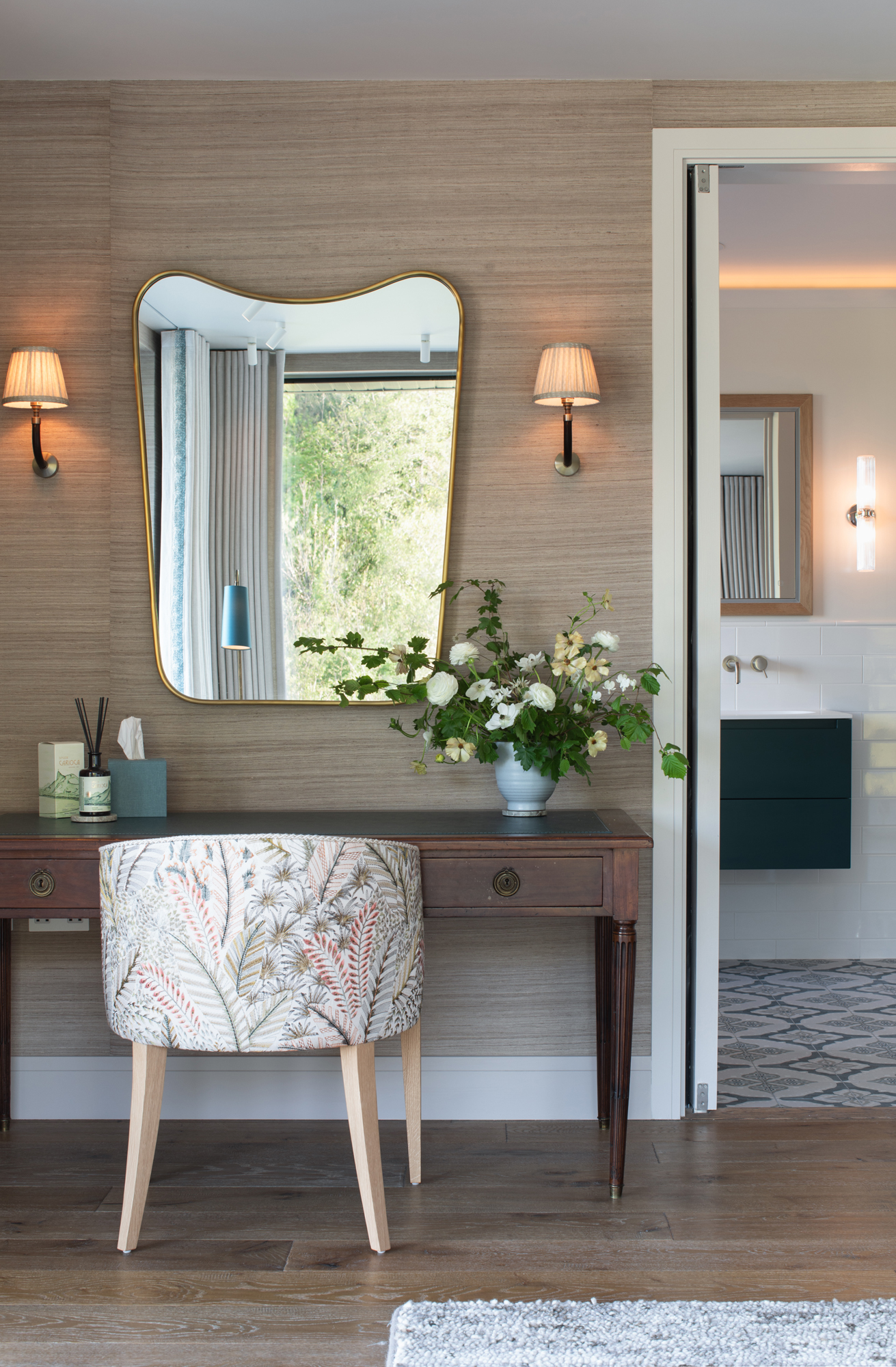 Dressing table and mirror within a private bedroom suite of a contemporary riverside new build, reflecting a calm, luxury interior architecture approach to high-end residential design.