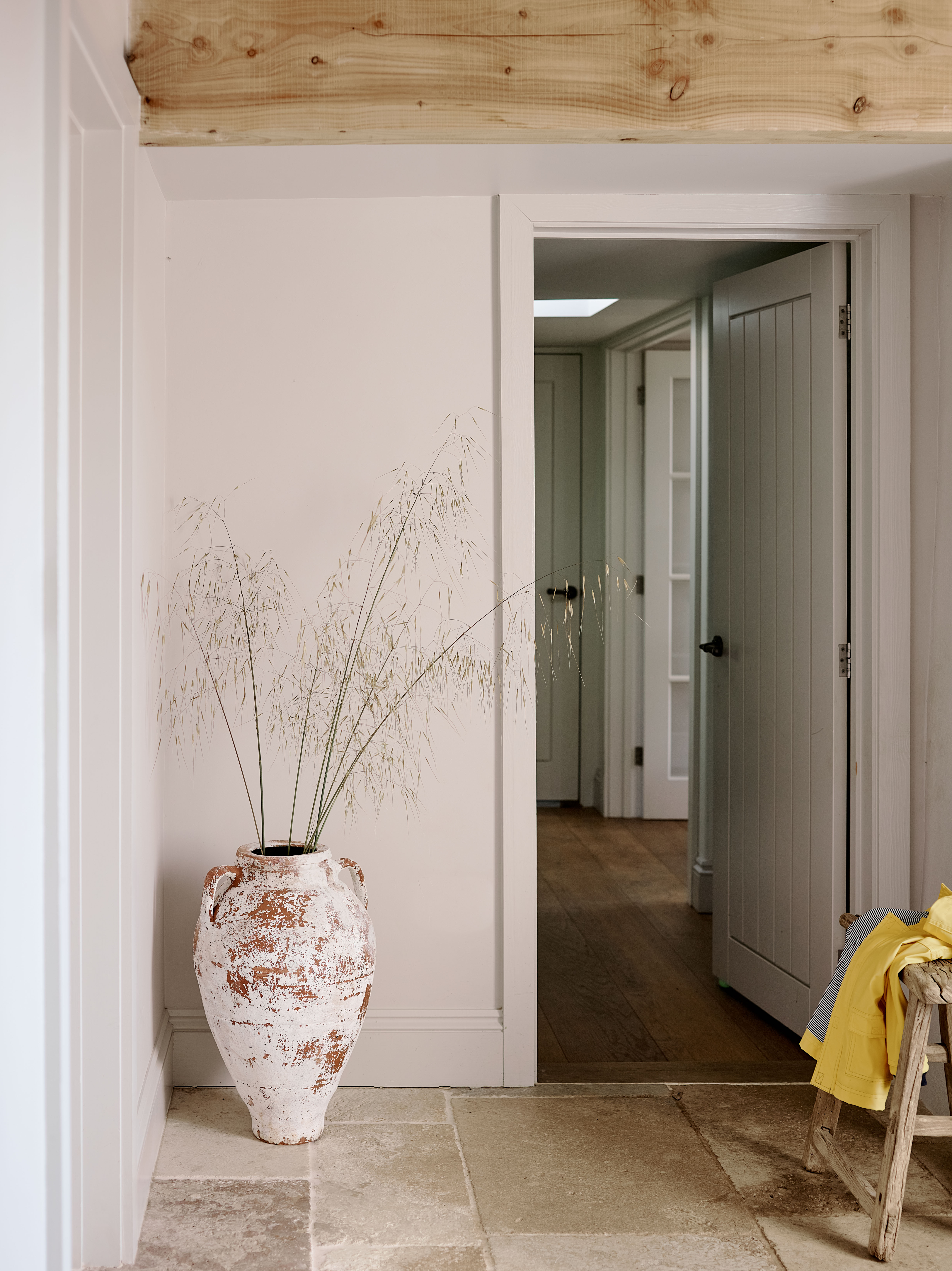 Hallway in a remote West Cornwall cottage showing a reworked circulation space with natural materials, soft colours and traditional details, redesigned as part of a full house refurbishment.