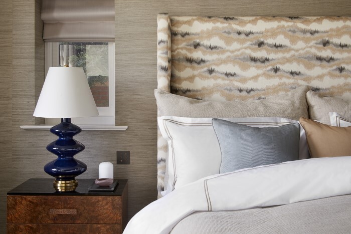 Bed with bedside table and lamp