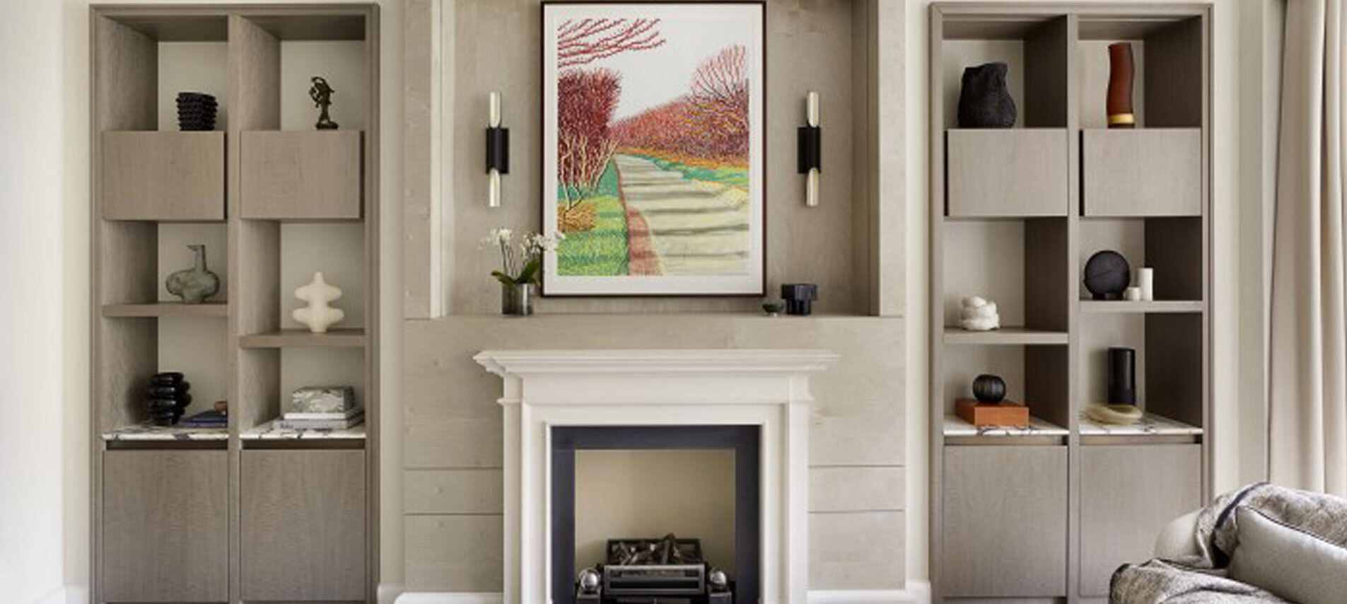 Fireplace with shelving either side