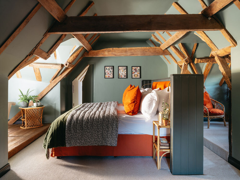 Bedroom with exposed beams above bed