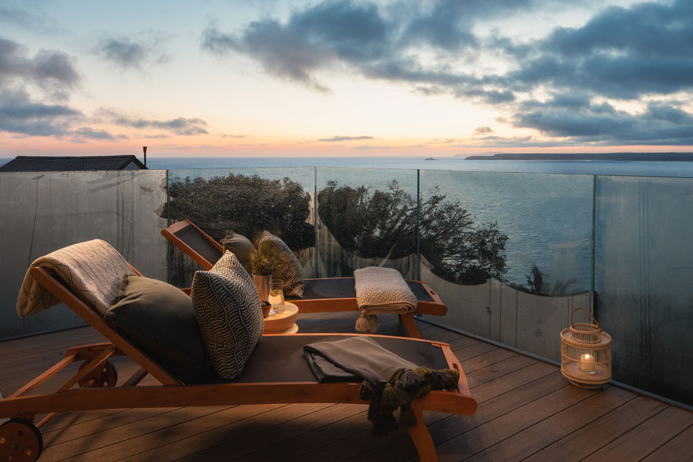 Balcony seating area at sunset