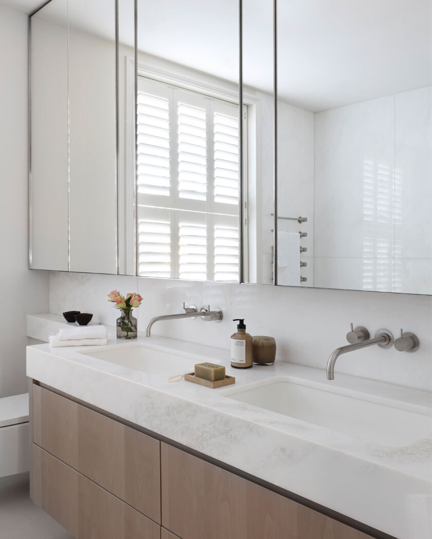 Bathroom with double sinks and mirror
