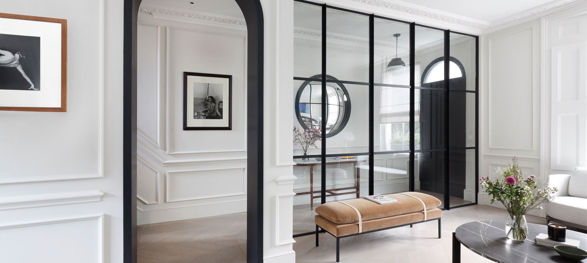 Arched doorway next to mirror and seating