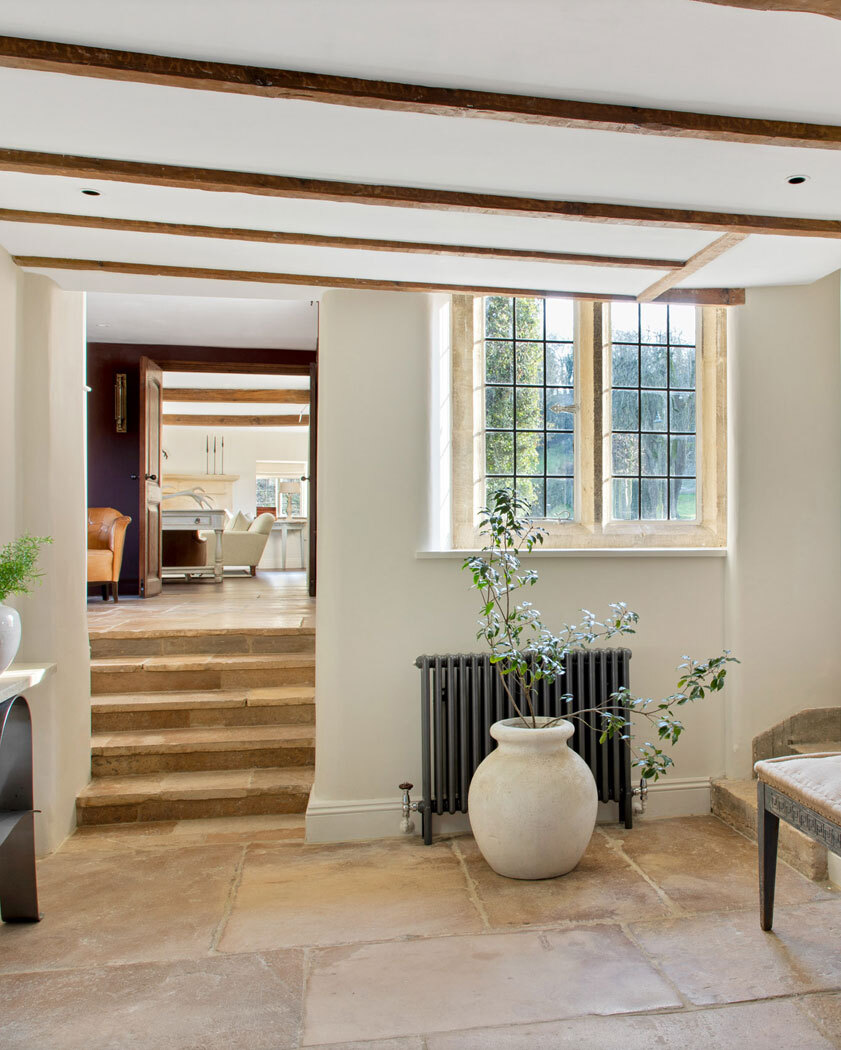 Enterance room with stairs leading to another floor