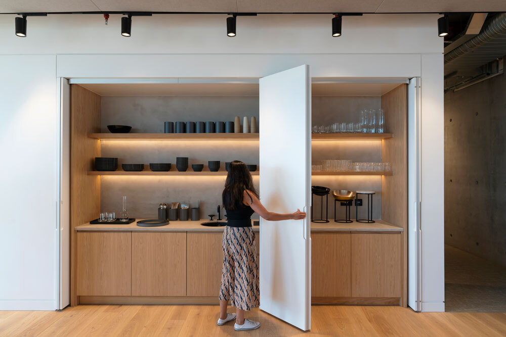 Kitchen cabinet open showing drinks storage 