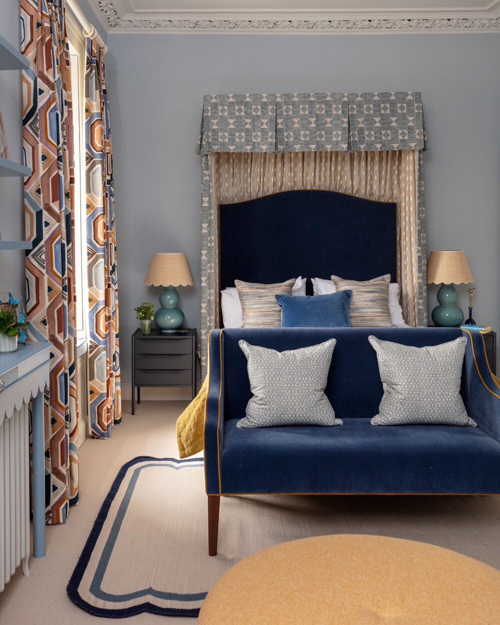 Bed with sofa at the end