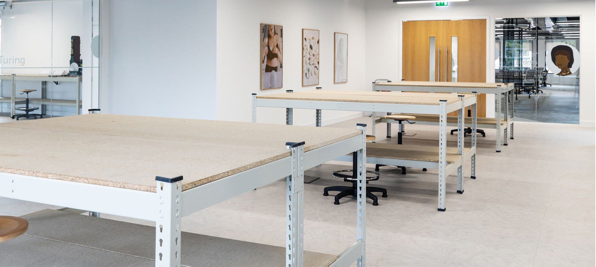 Desks lined up in work space