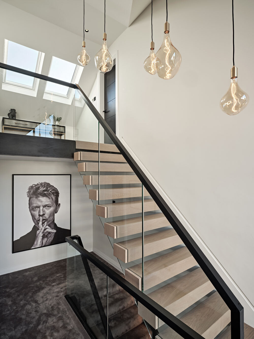 Staircase with framed artwork