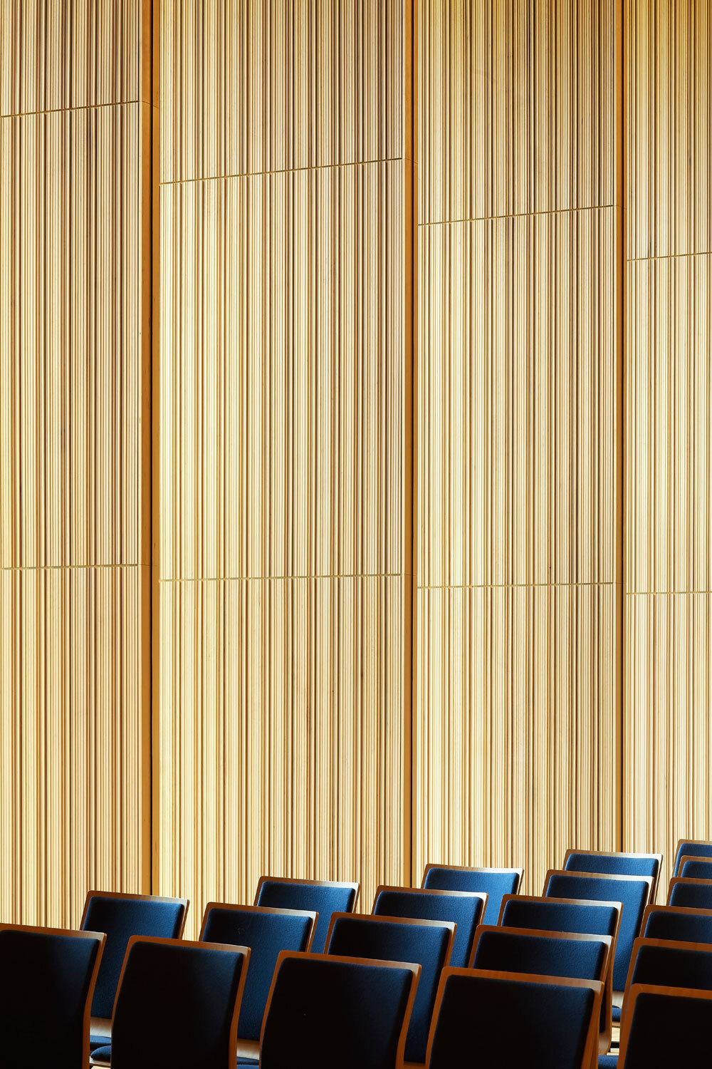 Wooden walls with black chairs