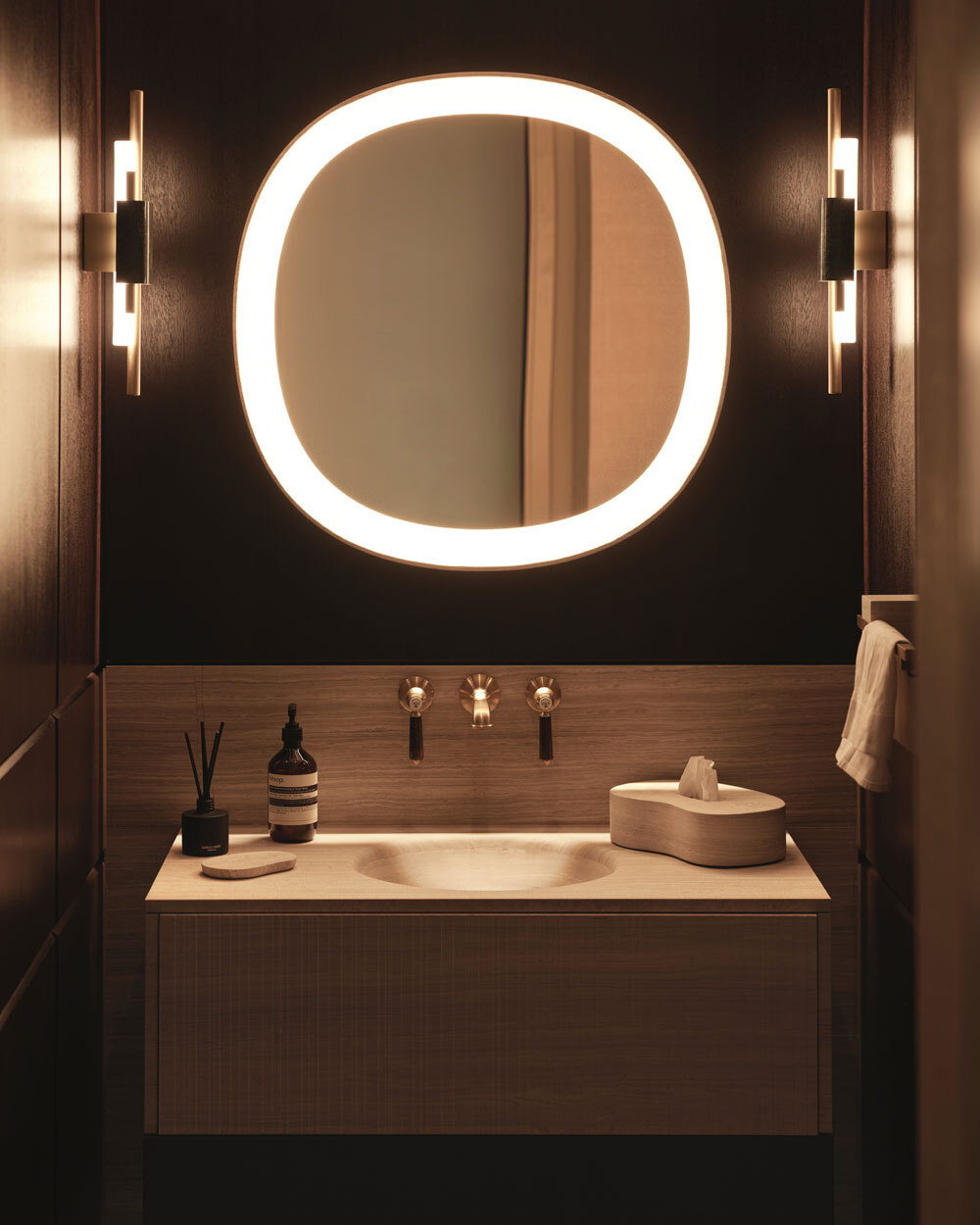 Sink with circle mirror above
