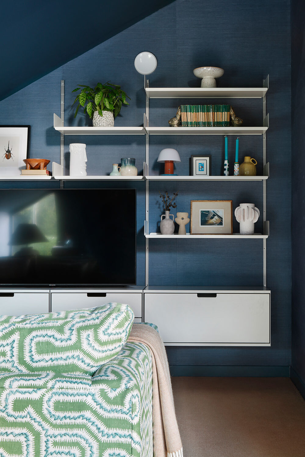 Shelving on wall with TV