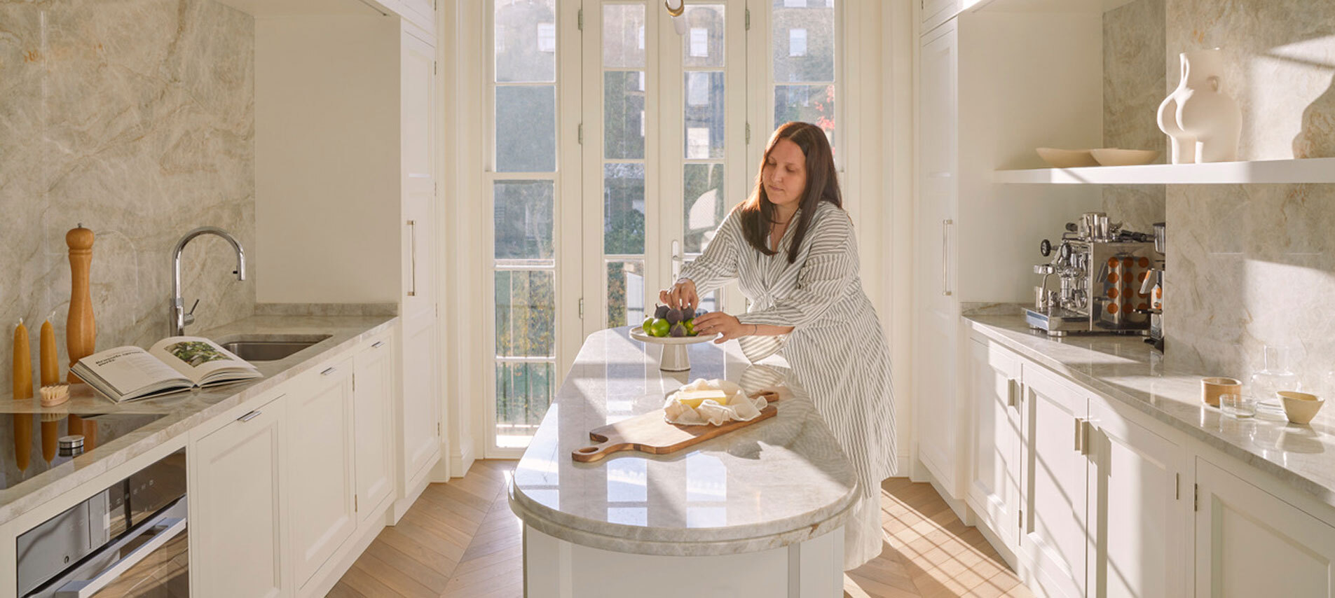 Women in kitchen organising fruit 